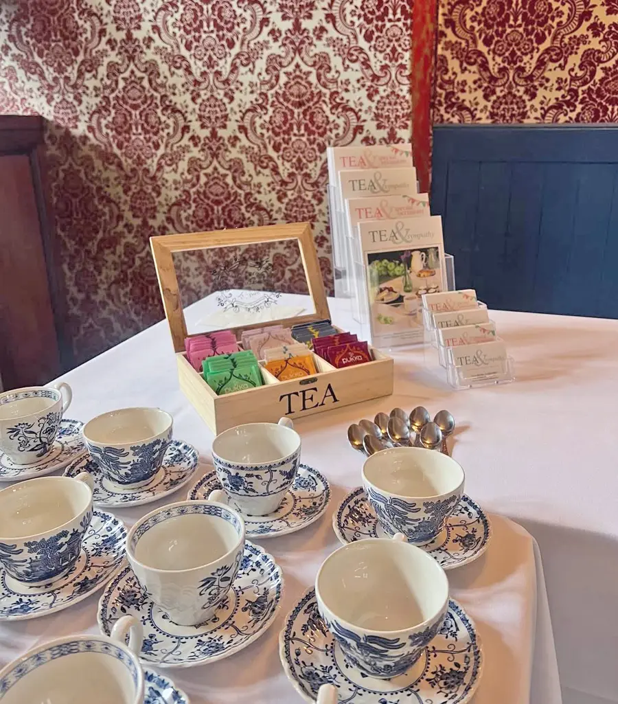 Decorative tea cups and a selection of teas