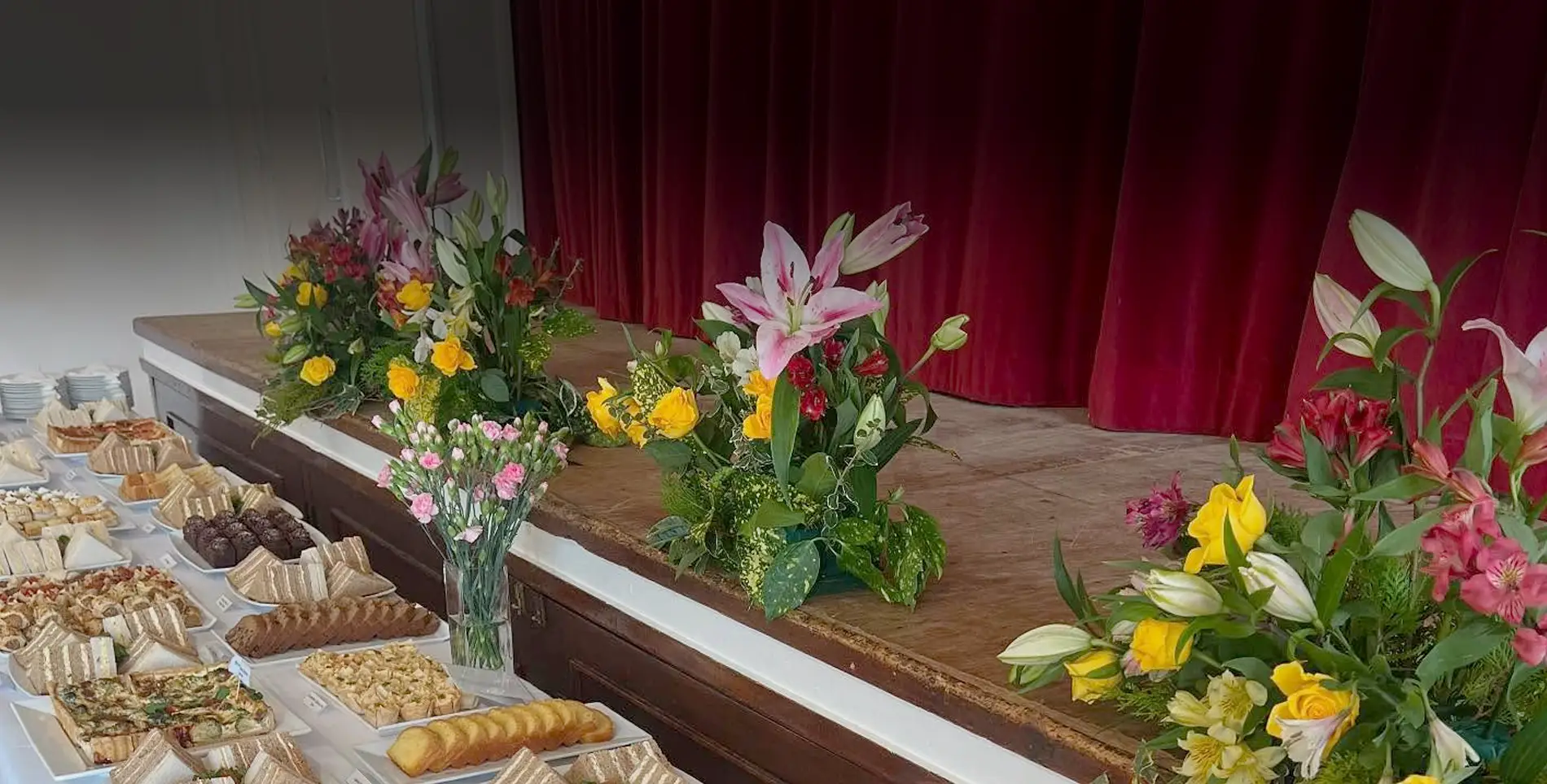 A table buffet and arranged flowers